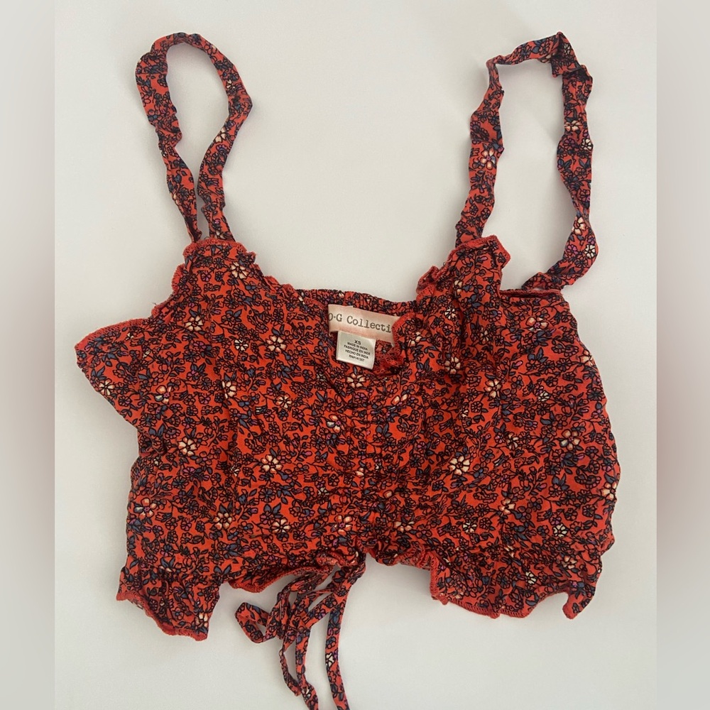 Orange crop top with blue and white floral print all over XS